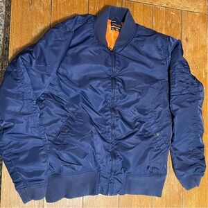 MA-1 style flight bomber jacket.
Navy Blue Bomber Jacket with Orange Lining